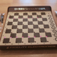 Illustration for article titled A Wall-Mounted Computer Chess Game Is Playable Art